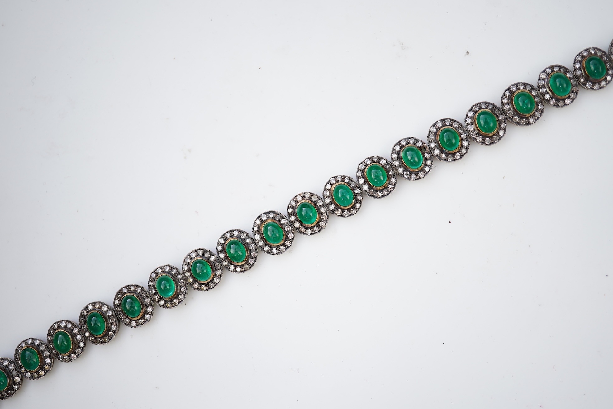 An emerald and diamond bracelet